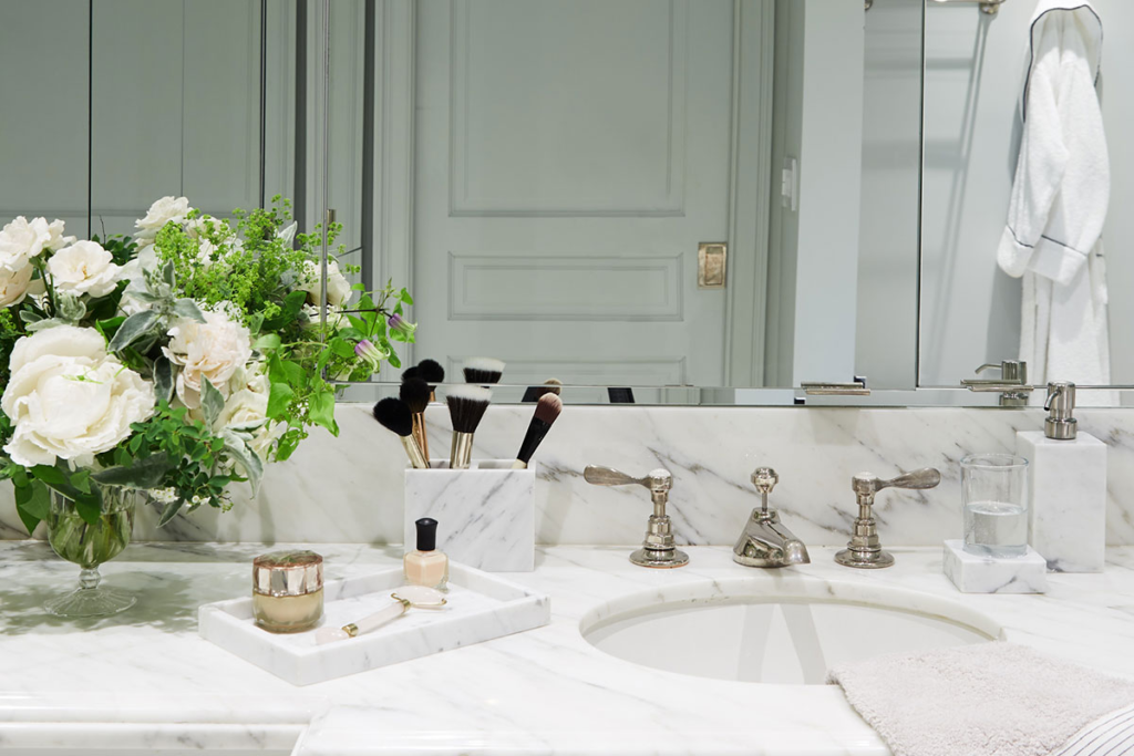 Bath products and a towel arranged for a relaxing aromatherapy self-care session.