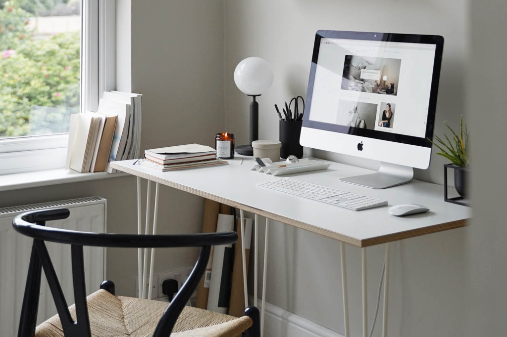 A clean and organized desk, representing the self-care practice of tidying a small space to reduce mental clutter.