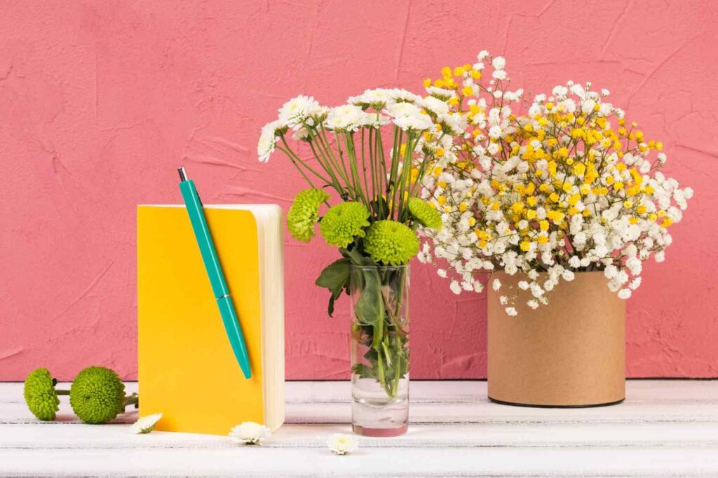 Adding plants and florals to a feminine home office for a fresh, lively feel.