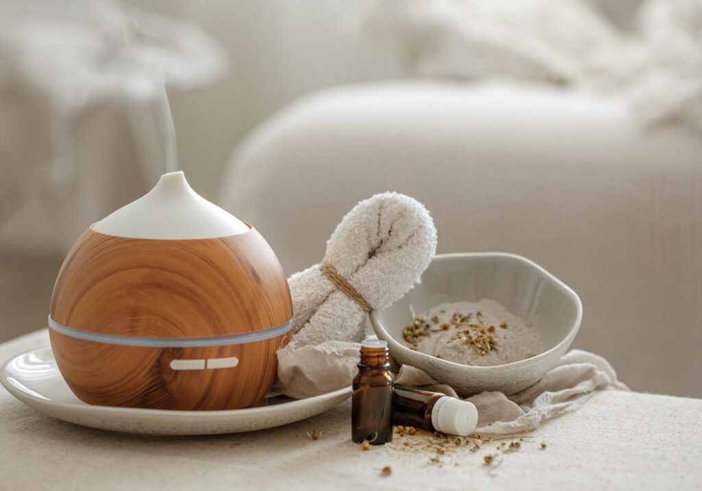 Diffusing essential oils like lavender and eucalyptus for a relaxing atmosphere during your 30-Day Winter Self-Care Challenge.
