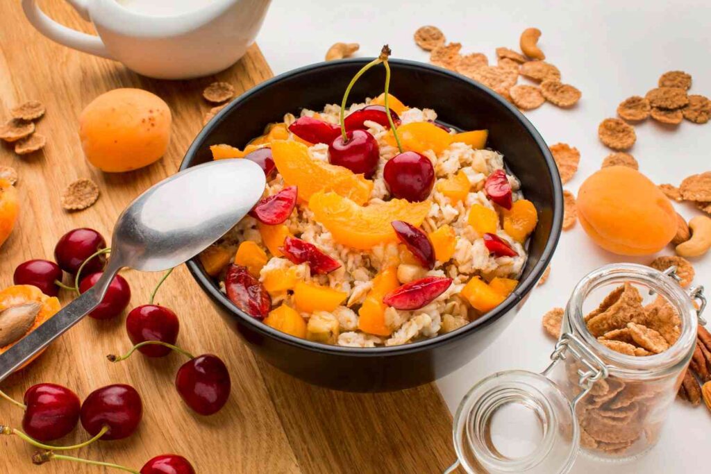 Bowl of oatmeal with apples and cinnamon for a cozy fall breakfast